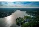 Aerial view of lake community with homes and boats at 610 Americas Cup Cv, Alpharetta, GA 30005