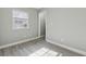 Empty bedroom with gray walls and wood-look flooring at 210 Sampson Ne St # Apt 6, Atlanta, GA 30312