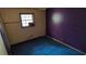 Vacant bedroom with blue carpet and purple wall at 868 Maxey Hill Ct, Stone Mountain, GA 30083