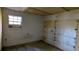 Garage interior with white walls and garage door at 868 Maxey Hill Ct, Stone Mountain, GA 30083