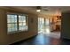 Kitchen and living area with sliding glass doors and dark wood floors at 868 Maxey Hill Ct, Stone Mountain, GA 30083