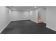 Finished basement with gray walls and dark gray flooring at 1052 Donnelly Sw Ave, Atlanta, GA 30310