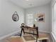 Bedroom with window, carpeted floor, and a workspace at 1052 Donnelly Sw Ave, Atlanta, GA 30310