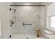 Large walk-in shower with marble walls and modern fixtures at 1052 Donnelly Sw Ave, Atlanta, GA 30310