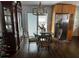 Bright dining area with glass-top table and hutch near sliding door at 5118 Hartsook Ne Dr, Covington, GA 30014