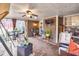 Cozy screened porch with seating area, ceiling fan, and TV at 1809 Francon Sw Ct, Conyers, GA 30094