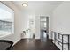 Bright hallway with dark hardwood floors and access to bedrooms at 912 Ira Sw St, Atlanta, GA 30310