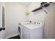 Convenient laundry room with washer, dryer, and shelving at 912 Ira Sw St, Atlanta, GA 30310