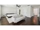 Bright bedroom with hardwood floors, neutral walls and a sitting area at 912 Ira Sw St, Atlanta, GA 30310