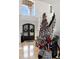 Elegant entryway with a grand staircase and a large Christmas tree at 1055 Leadenhall St, Alpharetta, GA 30022
