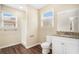 Updated bathroom with white vanity, granite countertop, and a shower/tub combo at 1742 Lynn Ln, Decatur, GA 30032