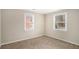 Bright bedroom with neutral walls and carpet at 1742 Lynn Ln, Decatur, GA 30032
