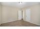 Spacious bedroom with two entry doors and carpet flooring at 1742 Lynn Ln, Decatur, GA 30032