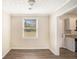 Simple dining room with neutral walls and dark brown flooring at 1742 Lynn Ln, Decatur, GA 30032