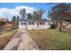 Charming ranch home with a red door and well-manicured lawn at 1742 Lynn Ln, Decatur, GA 30032