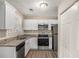 Modern kitchen with white cabinets and granite countertops at 1742 Lynn Ln, Decatur, GA 30032