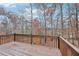 Wooden deck with wooded backyard views at 3315 Goldmist Dr, Buford, GA 30519