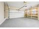 Garage interior with storage shelves and an automatic door opener at 3315 Goldmist Dr, Buford, GA 30519