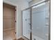 Large walk-in shower with glass enclosure and built-in shelving at 2200 Croghan Dr, Hampton, GA 30228