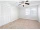 Bedroom with neutral walls, carpet, and double doors at 6841 Fairway Ridge, Douglasville, GA 30134