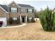 Two-story home with a landscaped yard and walkway at 1291 Vienna Ct, Hampton, GA 30228