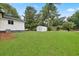 Large backyard with grassy area and storage shed at 1396 Iron Gate Blvd, Jonesboro, GA 30238
