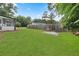 Spacious backyard with grassy lawn, shed, and patio area at 1396 Iron Gate Blvd, Jonesboro, GA 30238