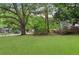 Large backyard with lush greenery and mature trees, providing privacy at 1396 Iron Gate Blvd, Jonesboro, GA 30238