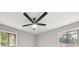 Well-lit bedroom featuring a ceiling fan and two windows at 1396 Iron Gate Blvd, Jonesboro, GA 30238