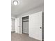 Bedroom with gray walls, carpet, and double door closet at 1396 Iron Gate Blvd, Jonesboro, GA 30238