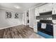 Updated kitchen with stainless steel appliances and a view into the dining area at 1396 Iron Gate Blvd, Jonesboro, GA 30238