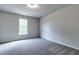 Spacious bedroom with neutral walls and carpet at 301 Delta Dr, Mcdonough, GA 30252