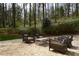 Gravel patio with wicker seating and a small table at 663 Carriage Nw Way, Atlanta, GA 30327