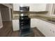 Kitchen with granite countertops, stainless steel appliances, and white cabinets at 2785 Battle Forrest Dr, Decatur, GA 30034