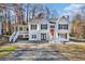 Two-story house with white siding, red door, and wraparound porch at 3563 Stratford, Douglasville, GA 30135
