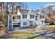 Two-story house with white siding, red door, and wraparound porch at 3563 Stratford, Douglasville, GA 30135