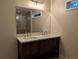 Double vanity bathroom with a large mirror and a walk-in shower at 550 Oglesby Bridge Se Rd, Conyers, GA 30094