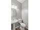 Simple bathroom with pedestal sink and toilet at 5667 Cascade Sw Run, Atlanta, GA 30336