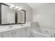 Relaxing bathroom with double vanity and soaking tub at 5667 Cascade Sw Run, Atlanta, GA 30336