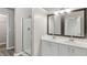 Bathroom boasts double vanity and walk-in shower at 5667 Cascade Sw Run, Atlanta, GA 30336