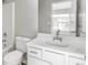 Clean bathroom with white vanity and bathtub at 5667 Cascade Sw Run, Atlanta, GA 30336