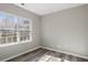 Bright bedroom with neutral walls and wood-look floors at 5667 Cascade Sw Run, Atlanta, GA 30336
