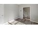 Spacious bedroom with neutral walls and wood-look floors at 5667 Cascade Sw Run, Atlanta, GA 30336