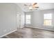 Bright bedroom with ceiling fan and hardwood floors at 5667 Cascade Sw Run, Atlanta, GA 30336