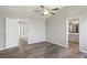 Spacious bedroom with access to bathroom and hardwood floors at 5667 Cascade Sw Run, Atlanta, GA 30336