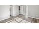 Bright bedroom with wood-look floors and access to bathroom at 5667 Cascade Sw Run, Atlanta, GA 30336