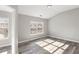 Well-lit bedroom with large window and hardwood floors at 5667 Cascade Sw Run, Atlanta, GA 30336