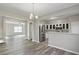 Open dining area with kitchen access and view of living room at 5667 Cascade Sw Run, Atlanta, GA 30336