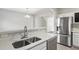 Modern kitchen features stainless steel appliances and white cabinetry at 5667 Cascade Sw Run, Atlanta, GA 30336
