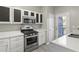 Kitchen with stainless steel appliances and access to deck at 5667 Cascade Sw Run, Atlanta, GA 30336